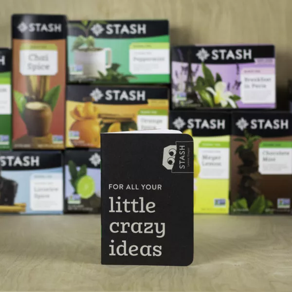 Stash Tea - Scout Books - 5706 - SQUARE A notebook in front of tea boxes